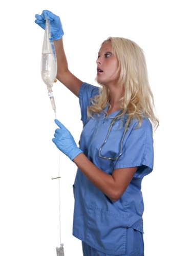 nurse holding IV bag and tubing